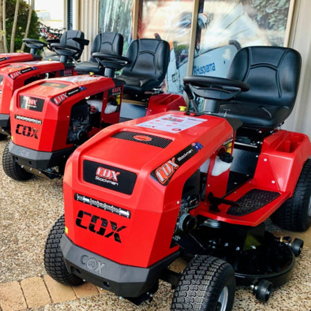 Image showing a row of Cox Stockman ride on mowers